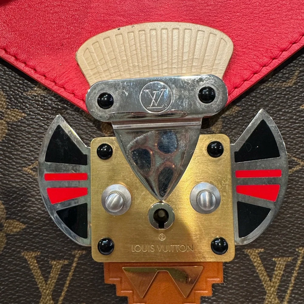 Authentic Louis Vuitton Tribal mask chained shoulder bag